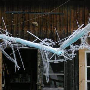 As daylight fades, A Roar, A Boar y Alice, a 22-foot-long LED light sculpture by Lumencrafter, begins to glow blue against the barn at the 2016 Local Colour Art Garden, Flesherton. LED lights run through three acrylic tubes joined with heavy gauge wire, wrapped with strips of steel mesh and polycarbonate. stunning; completely original.