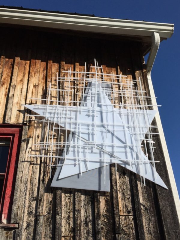Barn Star, soft white original handmade Lumencrafter LED light sculpture, hanging on the barn at the 2018 Local Colour Art Garden, Flesherton.