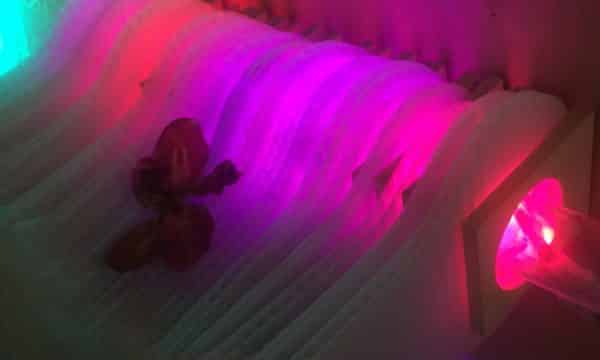 Close-up of Weight of Beauty, magenta-pink original handmade Lumencrafter LED light sculpture at Sourceworks Ceramics Studio for the 2018 Grey County Autumn Leaves Studio Tour.