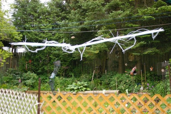 22-foot-long pendant LED light sculpture, changing colours.  LED lights run through three acrylic tubes joined with heavy gauge wire, wrapped with strips of steel mesh and polycarbonate.  stunning; completely original.