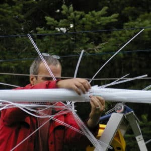 22-foot-long pendant LED light sculpture, changing colours. LED lights run through three acrylic tubes joined with heavy gauge wire, wrapped with strips of steel mesh and polycarbonate. stunning; completely original.