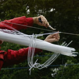 22-foot-long pendant LED light sculpture, changing colours. LED lights run through three acrylic tubes joined with heavy gauge wire, wrapped with strips of steel mesh and polycarbonate. stunning; completely original.