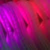 purple-red  layers of vertical polycarbonate, close-up of Weight of Beauty, an LED wall-mounted light sculpture by Lumencrafter.