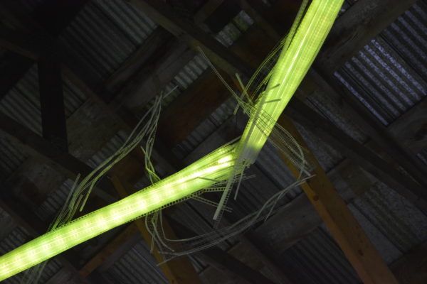 22-foot-long LED light sculpture, changing colours.  LED lights run through three acrylic tubes joined with heavy gauge wire, wrapped with strips of steel mesh and polycarbonate.  stunning; completely original.