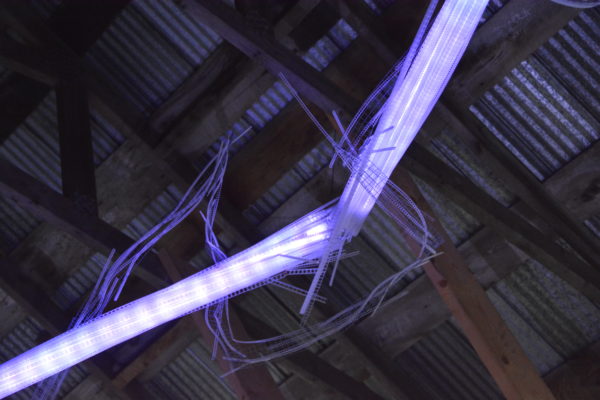 original LED light sculpture, 22 feet long, changing colours.  LED lights run through three acrylic tubes joined with heavy gauge wire, wrapped with strips of steel mesh and polycarbonate.  stunning; completely original.