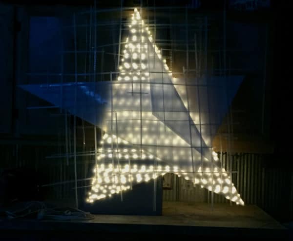 Barn Star, soft white original handmade LED light sculpture by Lumencrafter, lit at night, at Sourceworks Ceramics Studio for the 2018 Grey County Autumn Leaves Studio Tour.