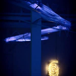 Two original handmade Lumencrafter LED light sculptures, In the Cloud in purple phase above and white spiral wall sconce If Not Now at Arcadia Art Gallery, Toronto, 2014.