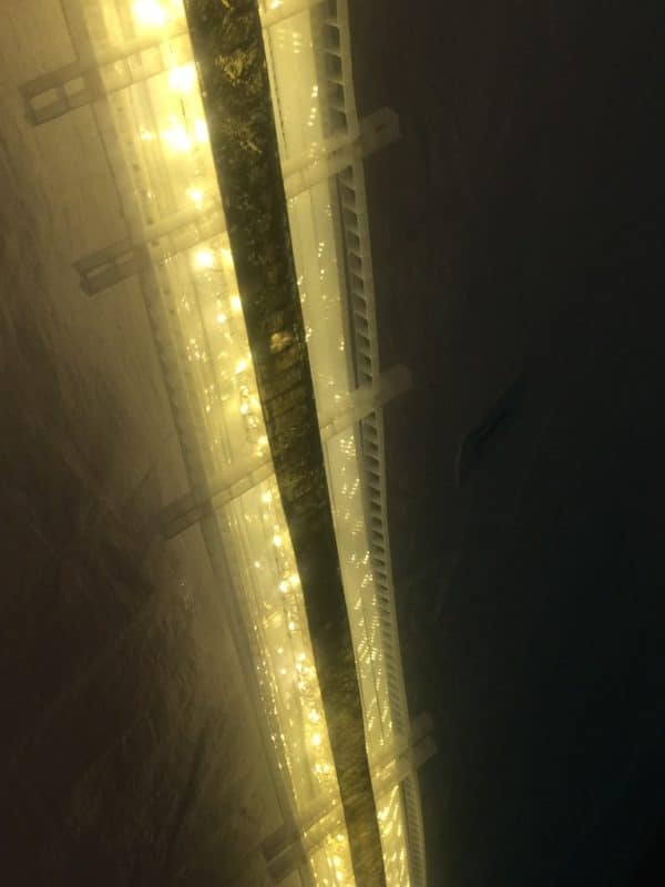 White Gold, an original LED light sculpture exhibited in the 2018 Grey County Autumn Leaves Studio Tour.  A one-inch wide strip of gold runs down the centre of a slender four-foot-long structure of polycarbonate struts and spars shot through with sparkling soft-white light.