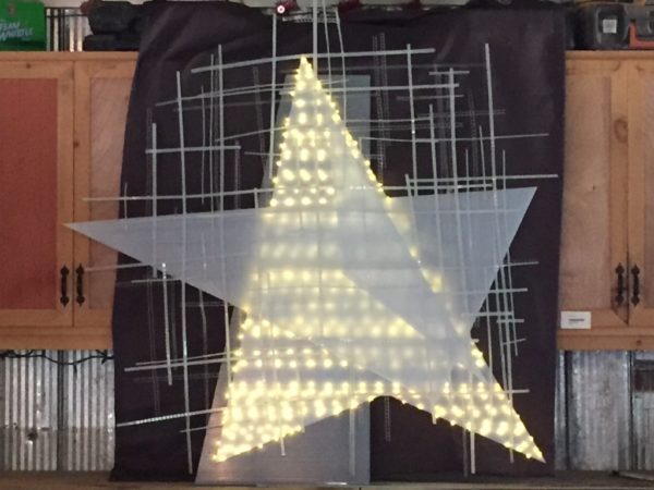 Barn Star, soft white original handmade LED light sculpture by Lumencrafter, lit in daylight, at Sourceworks Ceramics Studio for the 2018 Grey County Autumn Leaves Studio Tour.