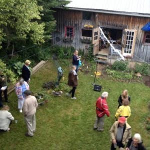 A Roar, A Boar y Alice, a 22-foot-long LED light sculpture by Lumencrafter hangs high above the 2016 Local Colour Art Garden as Flesherton locals and visitors arrive for the annual event. LED lights run through three acrylic tubes joined with heavy gauge wire, wrapped with strips of steel mesh and polycarbonate. stunning; completely original.
