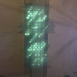 Solar Thing, unique solar-powered hand-made pale green four-foot long LED light sculpture by Lumencrafter, close-up, at the Grey County Autumn Leaves Studio Tour, Rocklyn, Ontario.